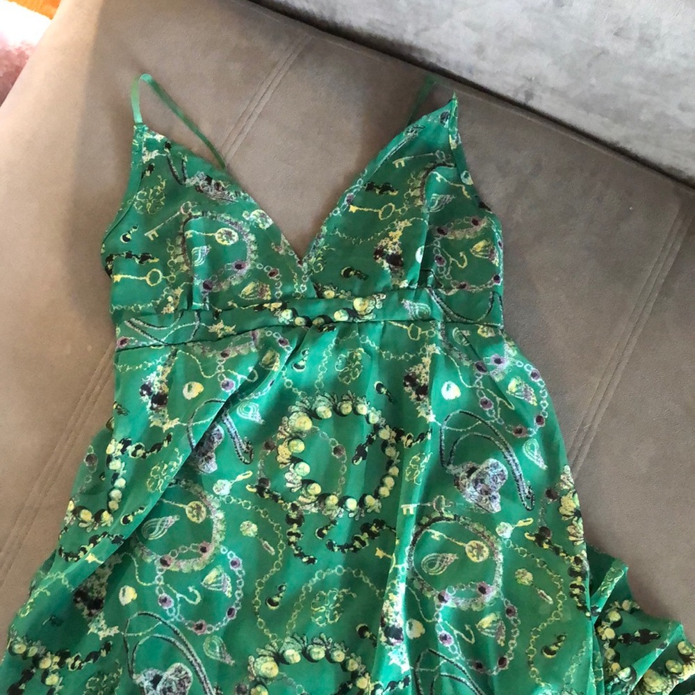 Green maxi dress with yellow key pattern.